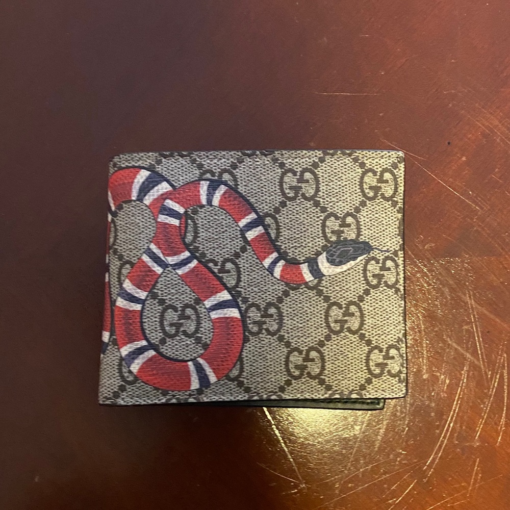 Gucci wallet with snake in print. Double folds, but don’t have original box.